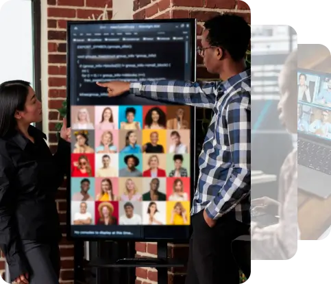 Two individuals stand next to a large screen displaying a grid of portraits, with lines of programming code appearing above, symbolizing technology and team collaboration.