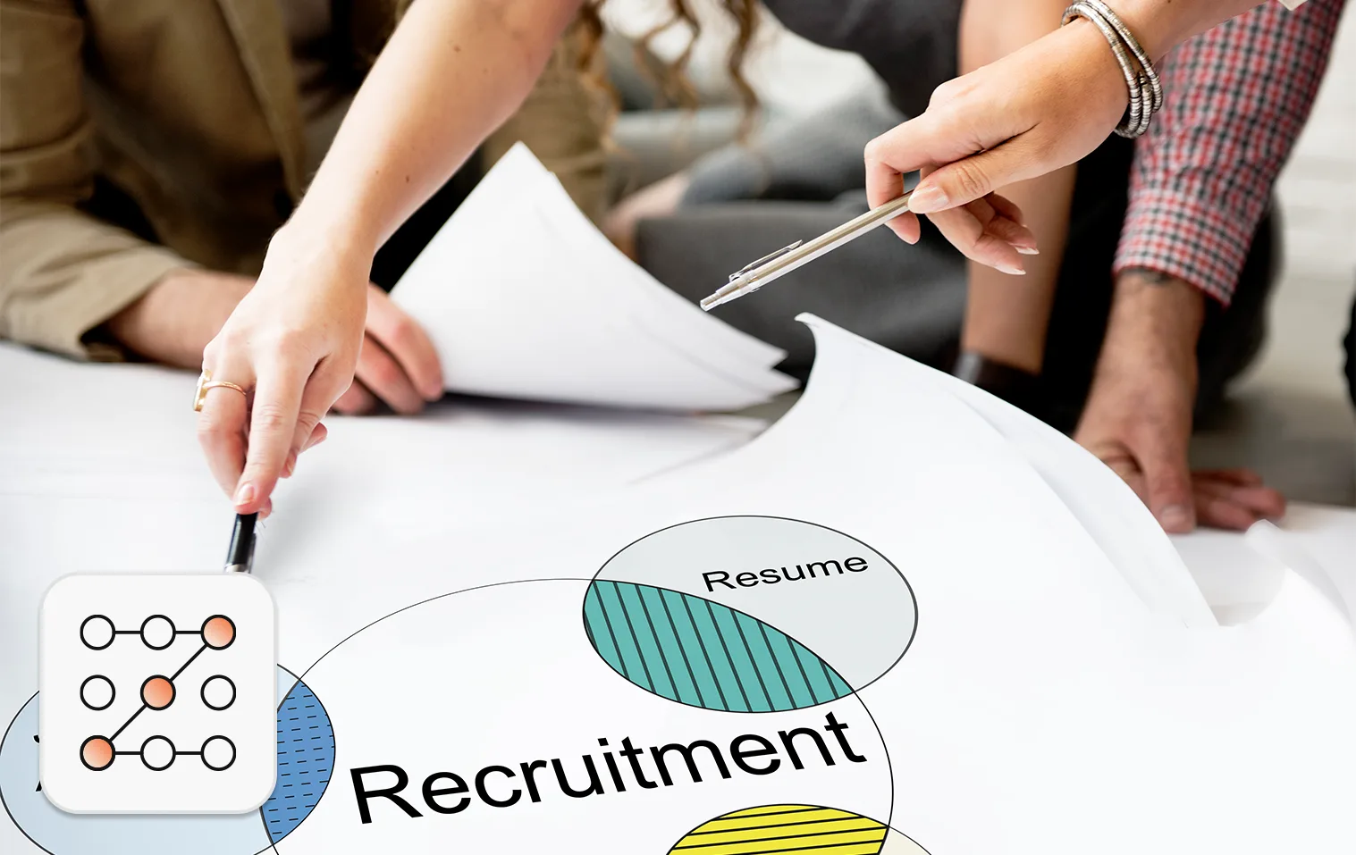 US hiring trends 2026 concept: Team of 3 reviewing a recruitment venn diagram