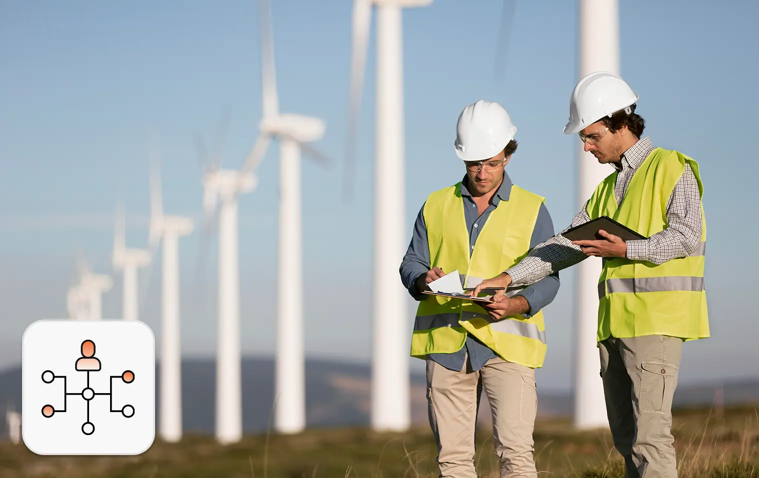 Engineers at a wind farm highlighting energy workforce staffing for renewable energy projects